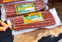 Load image into Gallery viewer, Sweet &amp; spicy and habanero salami stix on fur pelt.
